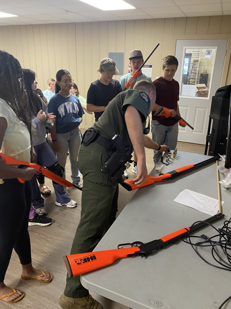 Game Warden Lane Young leading a safety course