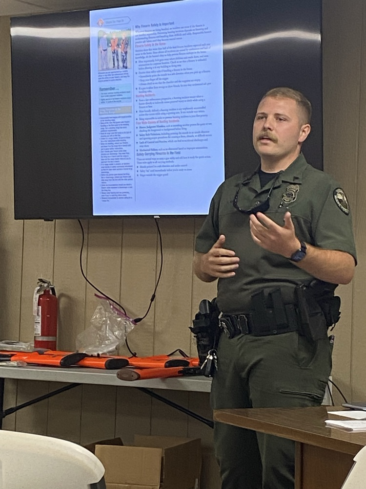Game Warden Lane Young leading a safety course