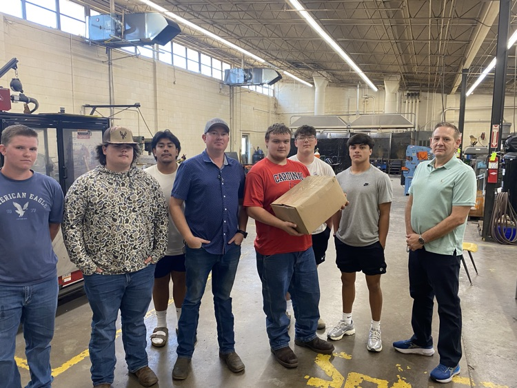 Welding Students accepting Sun-Air donation of safety materials