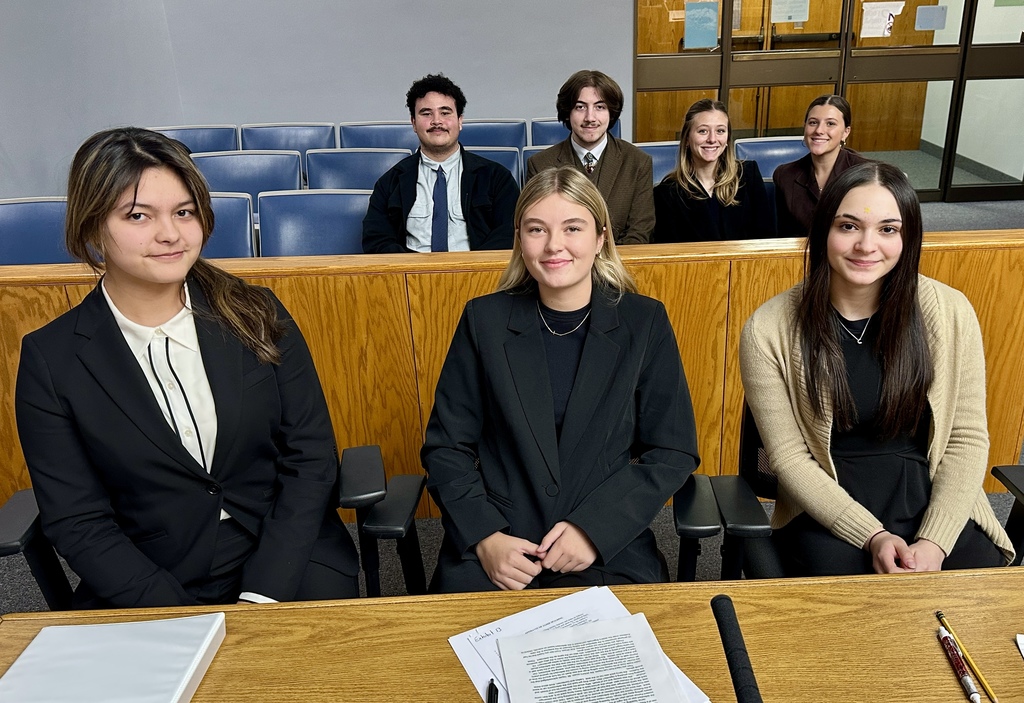 The Tiverton High School Mock Trial Team overcame its inexperience and a tough opponent in Cranston East High School to secure a critical victory today at the Joseph J. Garrahy Judicial Complex in Providence.    Brooke Sowa’s score on her closing argument served as the difference in the trial’s outcome.  Celina Medeiros and Nanami Cater performed well as Sowa’s co-counsel, while Beatrice Pimentel, Shawn Anderson, and Silas Aguiar delivered strong scores as witnesses. Adelaide Pimentel effectively served as the team’s rules expert.