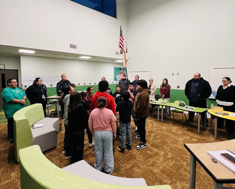 Performing the Flag Song at the School Board Meeting