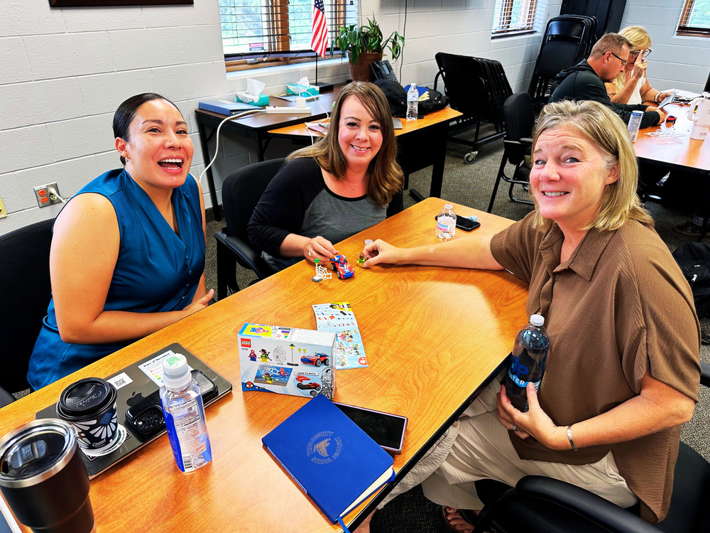 Administation working together on an activity during professional development training