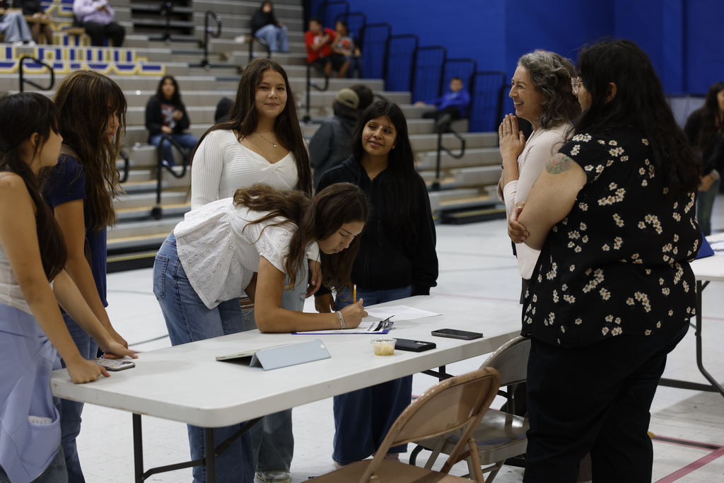 High School Students signing up for extra curriculum activities