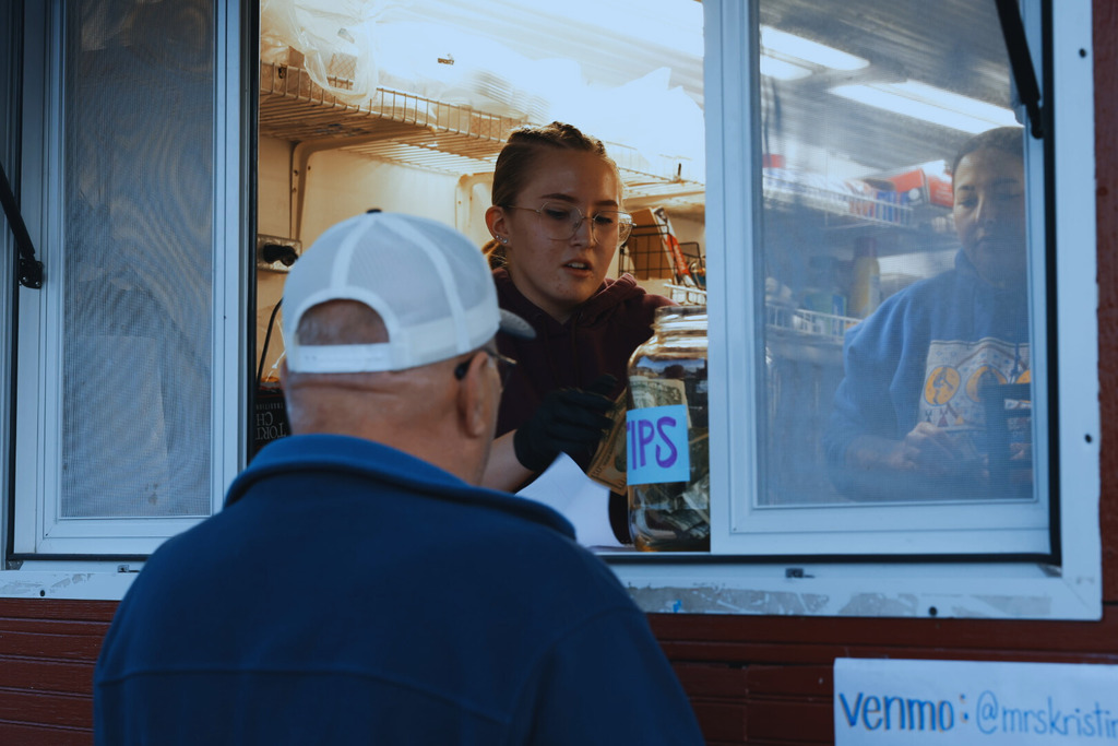 Junior Class Student taking an order. 