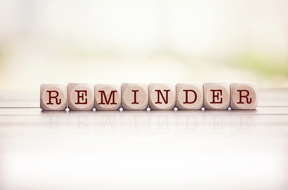 Reminder written on dice cubes in red letters