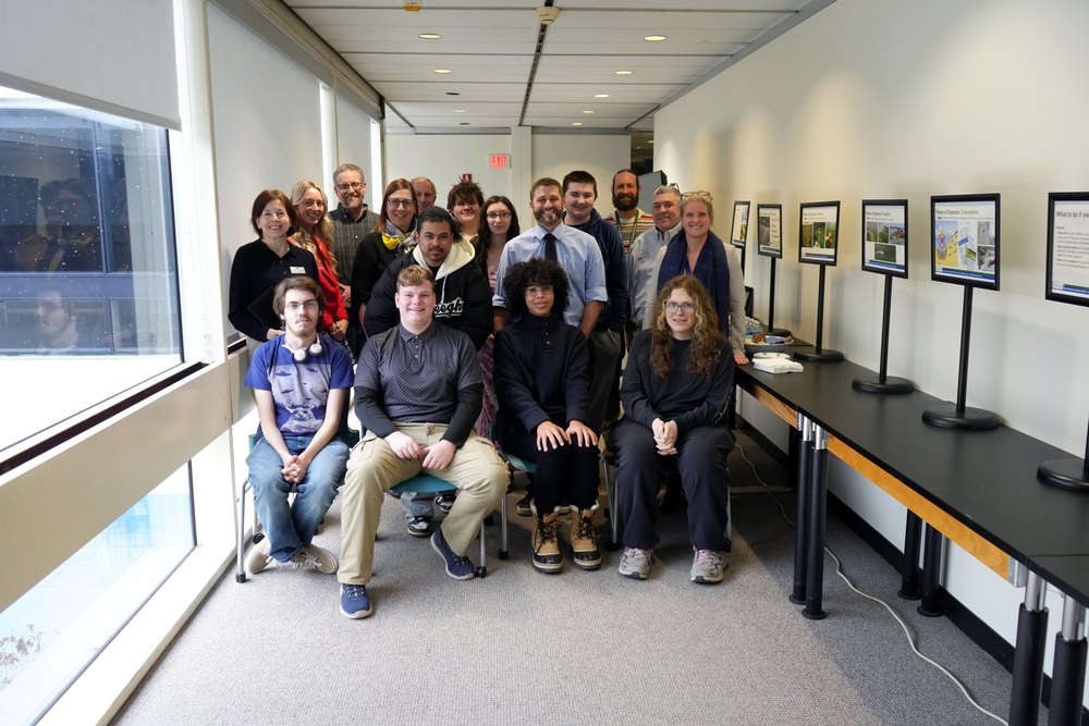 P-TECH Students along with TC3 faculty, smile in group photos with Dr. Anna Kelles