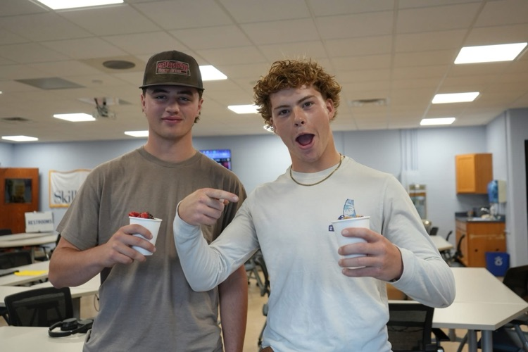 two students enjoying parfaits