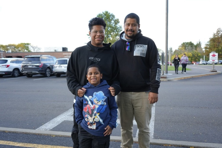 student and family walking into open house