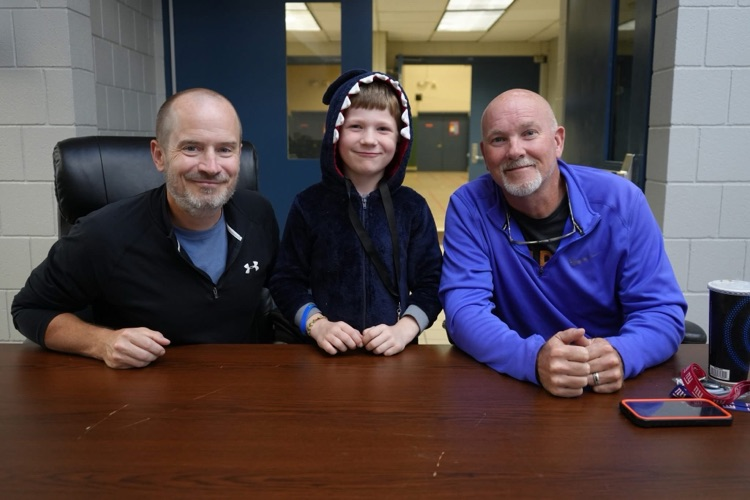 student with PE teachers