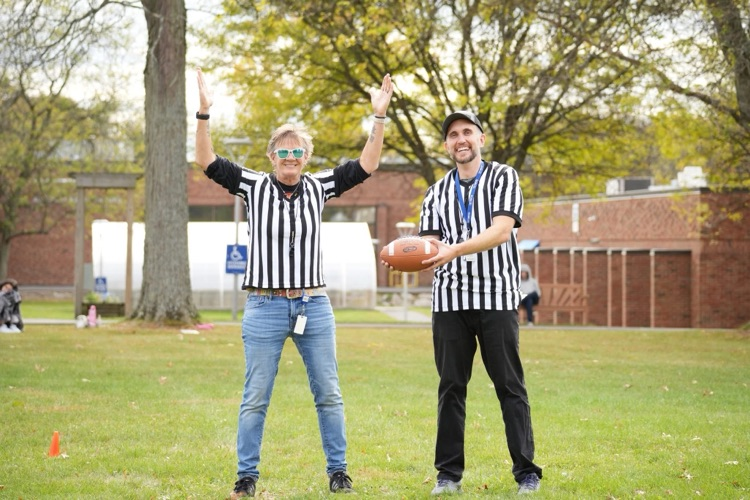RAS flag football referees posing for touchdown