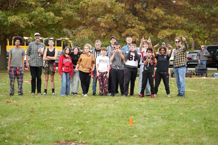 both teams posing for a whole group photo