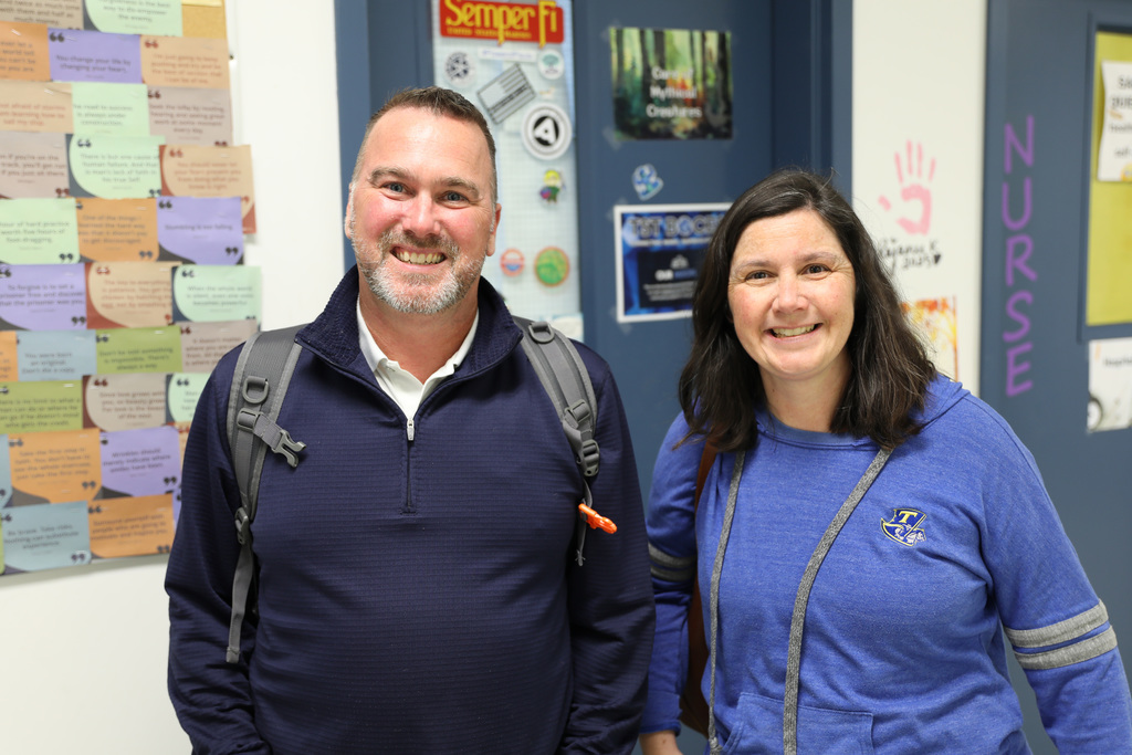 Two adults smiling for a photo