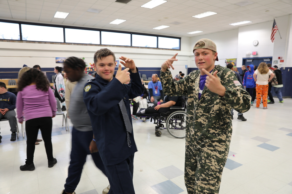 Two dancing students looking at camera 