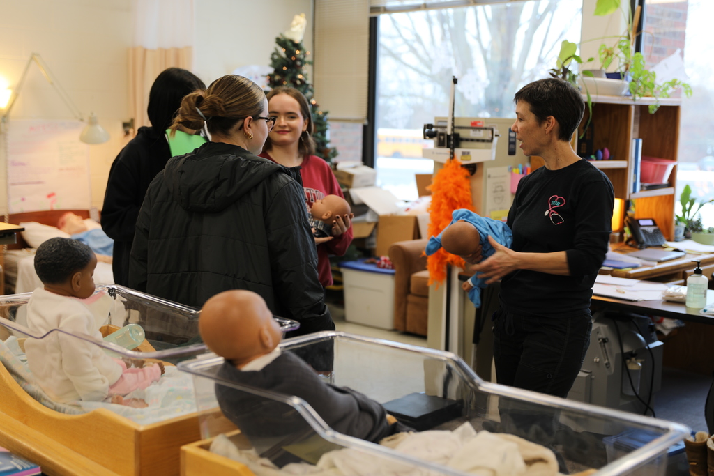 faculty showing potential new students about their program