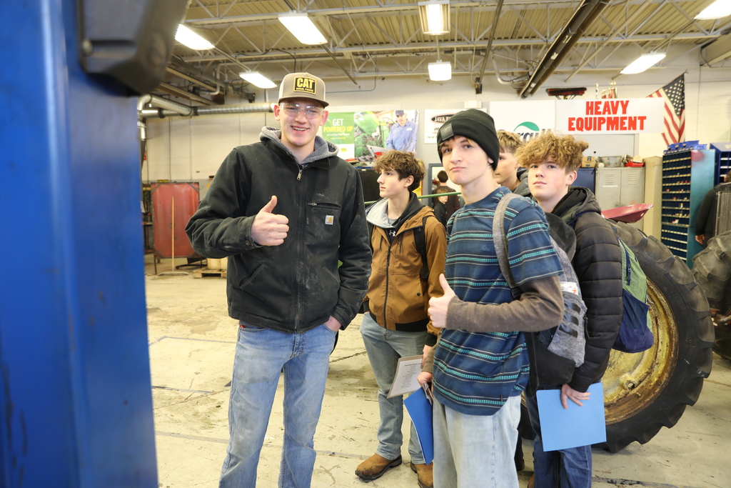 current and potential new students giving a thumbs up to camera