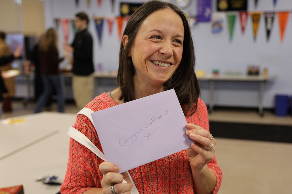Celebrating Jennifer Hightower, TST's newest National Board Certified Teacher: Jennifer Smiling with card