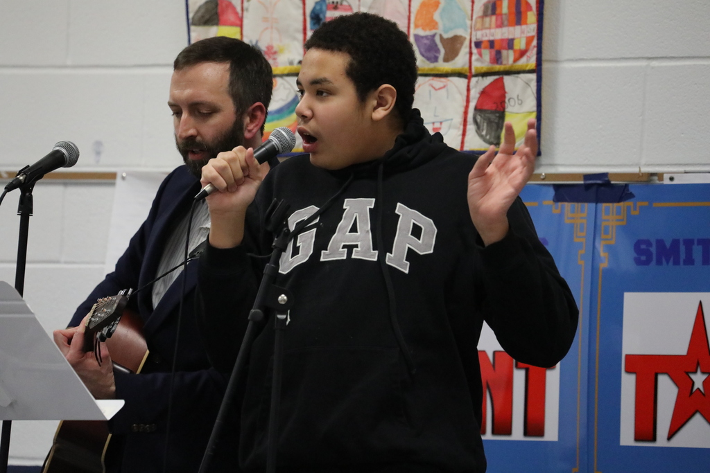 A student and a teacher performing at the talent show