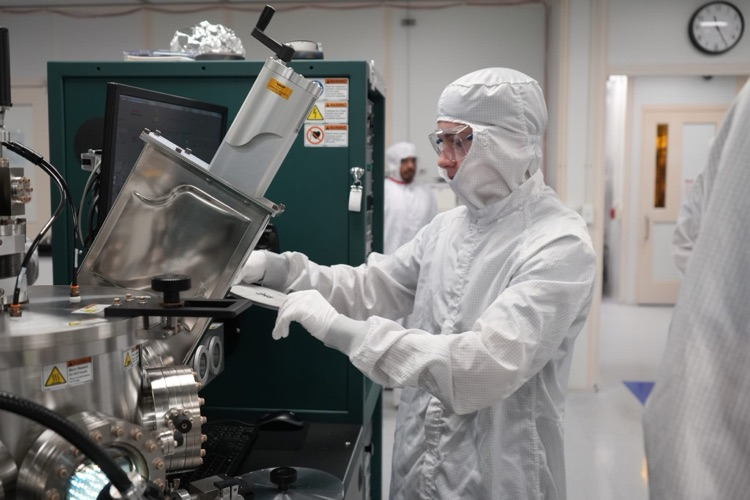 new visions engineering student in clean room at Cornell NanoScale Facility