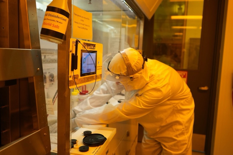 new visions engineering student in clean room at Cornell NanoScale Facility using chemicals on wafer