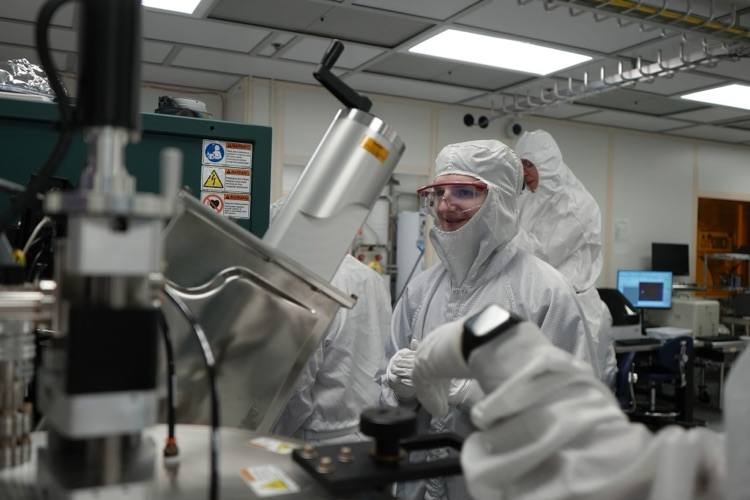new visions engineering student in clean room at Cornell NanoScale Facility using equipment