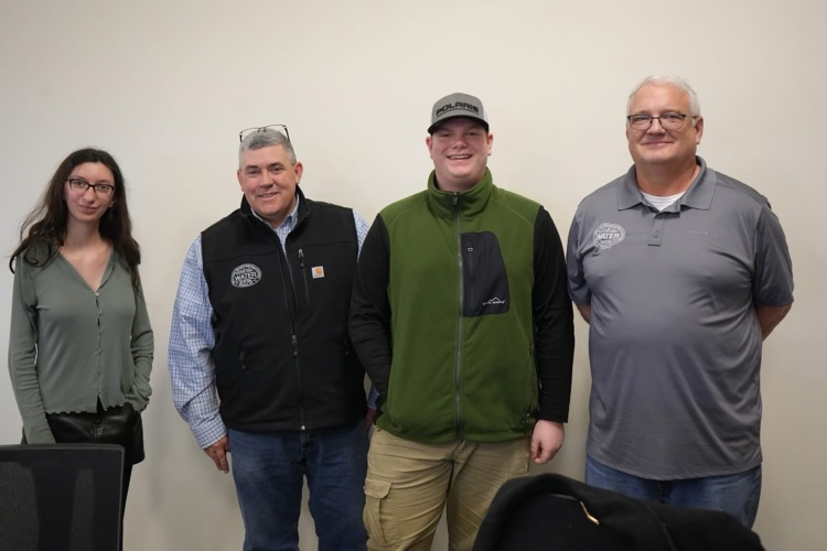Group photo with partners and students