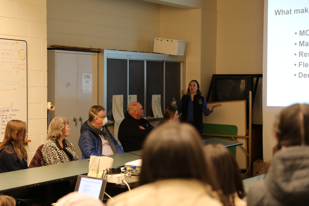 a teacher explaining info about their class