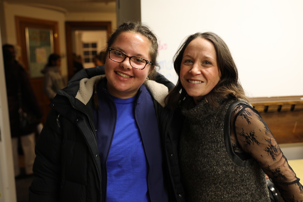 a teacher and student posing for a photo