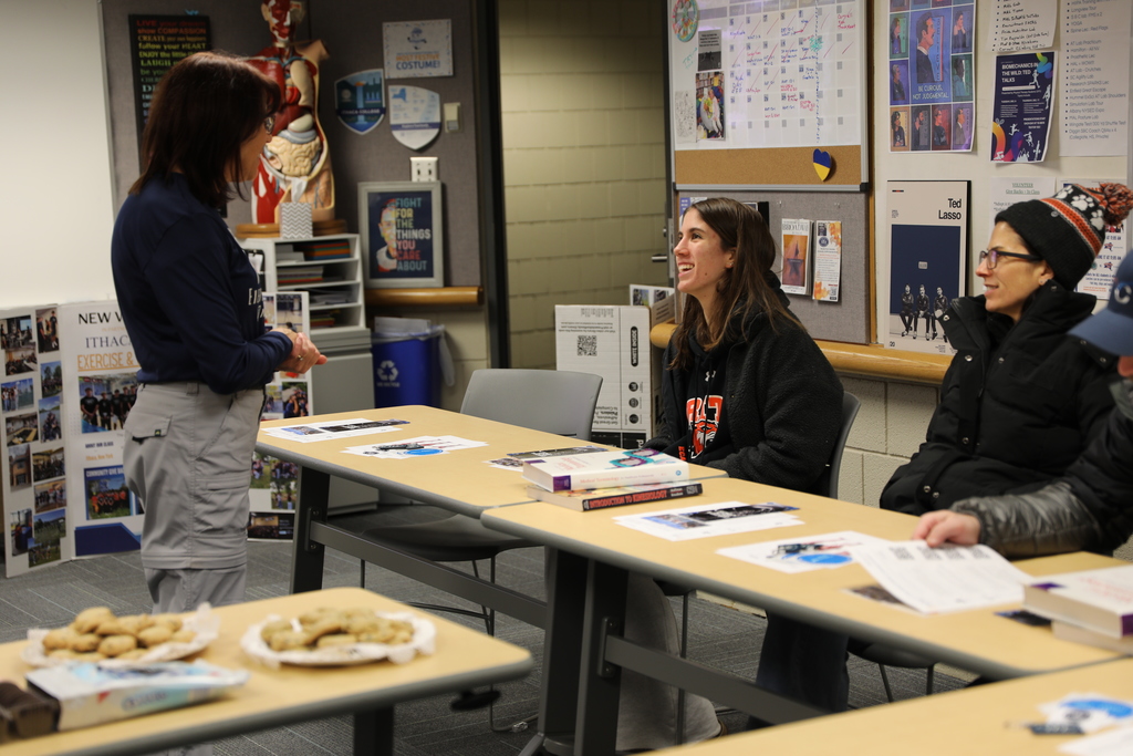 A student greeting the teacher in the open house