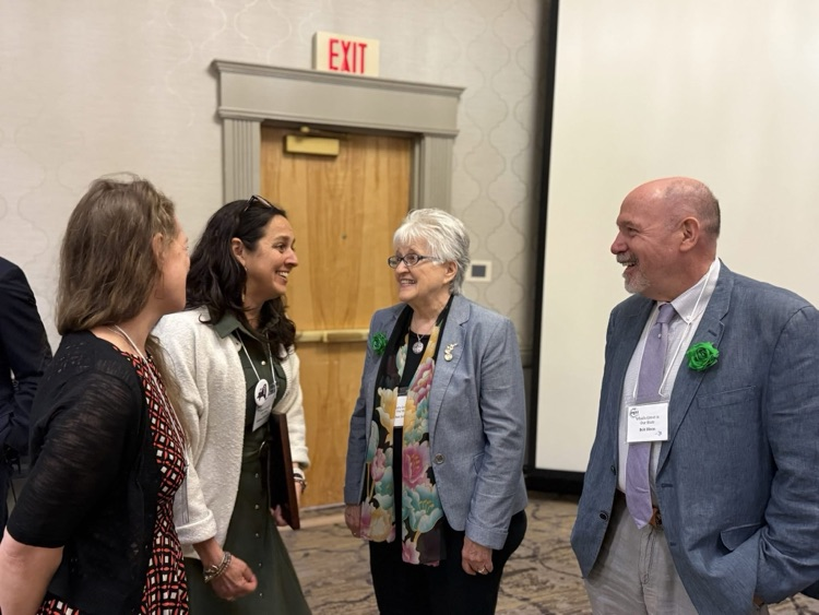  Dr. Dhundale, Ms. Jessica Hoff speak with award celebration attendees