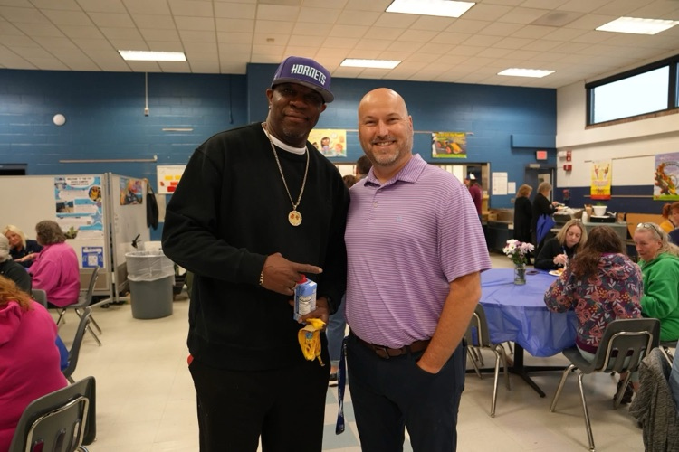 Scott Snyder and Big Mike smile together at the staff appreciation breakfast