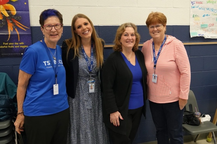 DS Lily Talcott smiles with three BOCES BOE members at the staff appreciation breakfast