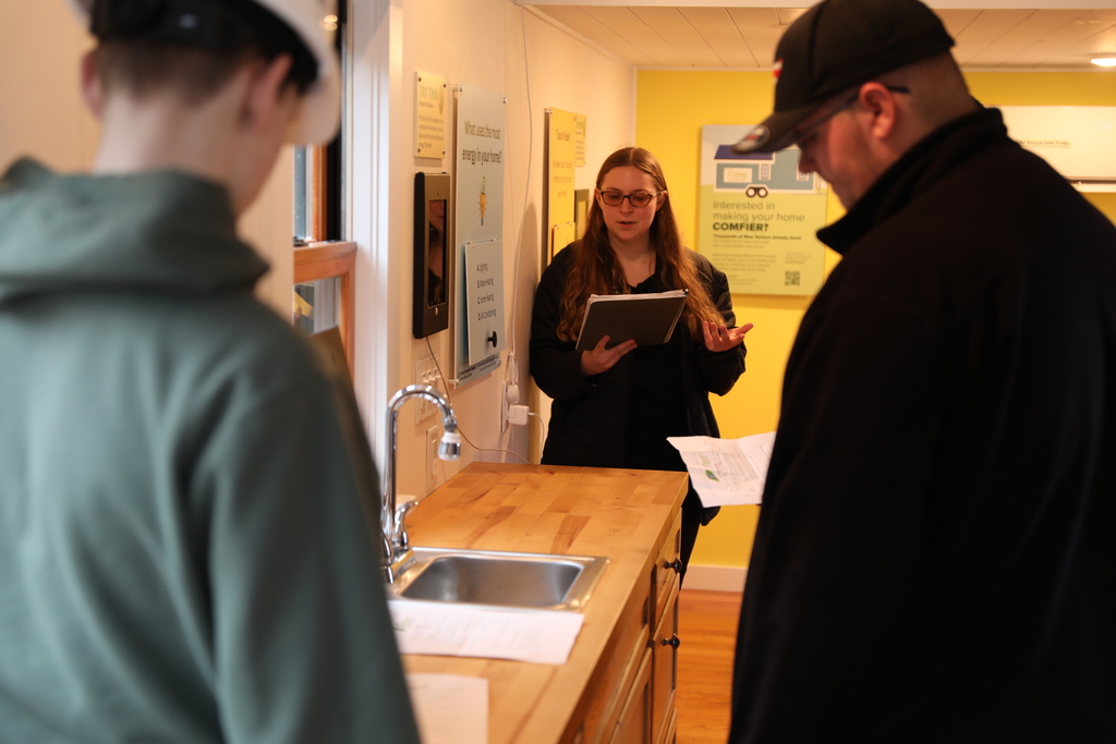 A staff member explaining what the PowerHouse is to students