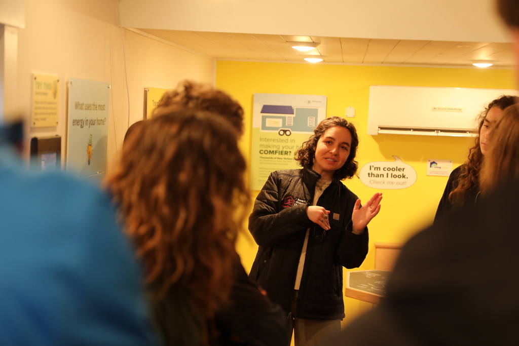 A CCE staff member explaining the PowerHouse to students