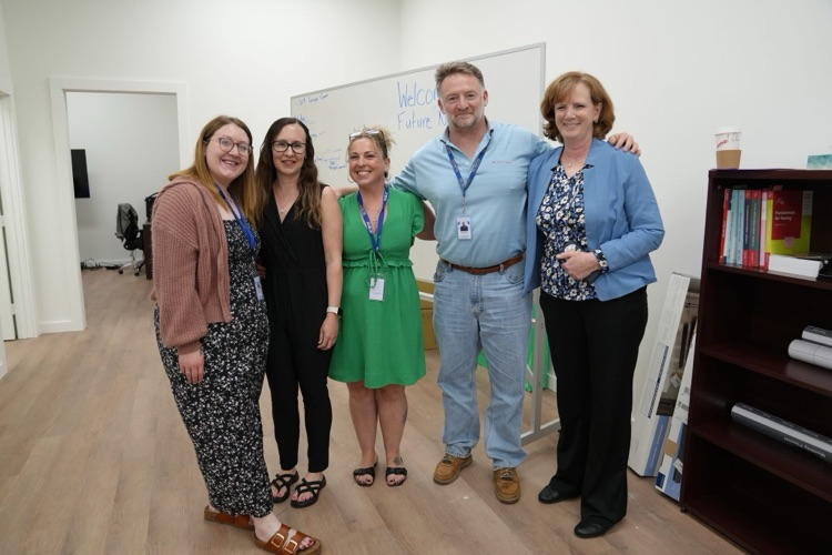 TST BOCES Adult Education and Practical Nursing Program staff members pose together in a classroom during student orientation.