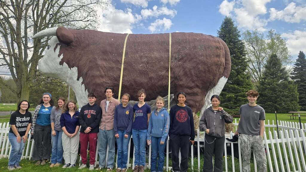 TST BOCES FFA students stand in front of the famous “Big Cow” landmark during the 2026 New York State FFA Convention.