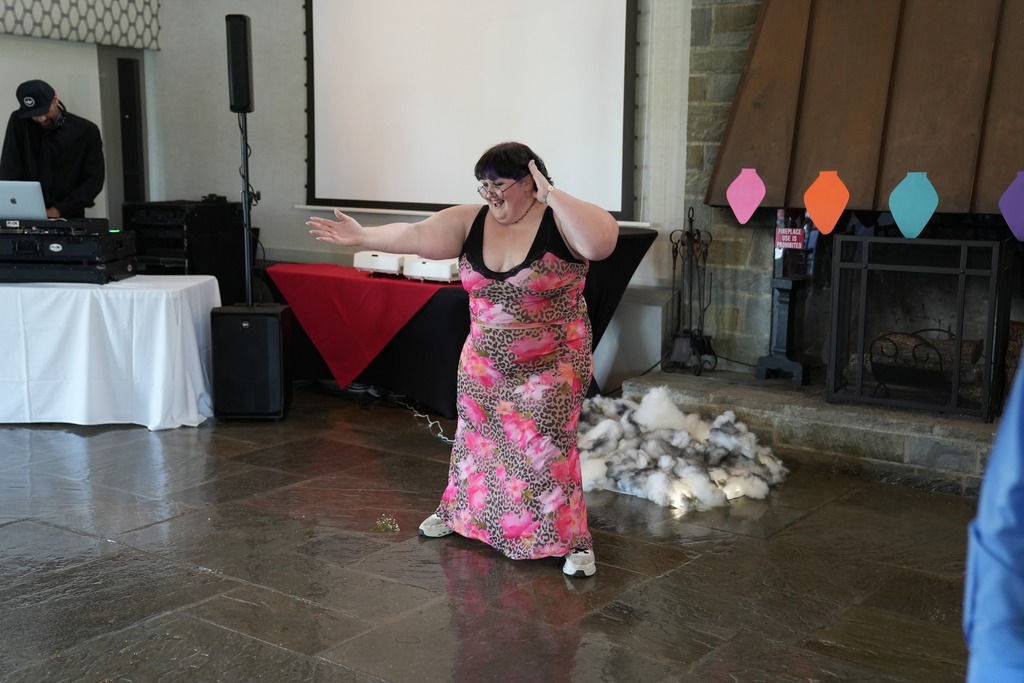 A student dances enthusiastically on the dance floor during the Turning Point Program’s annual dinner dance.