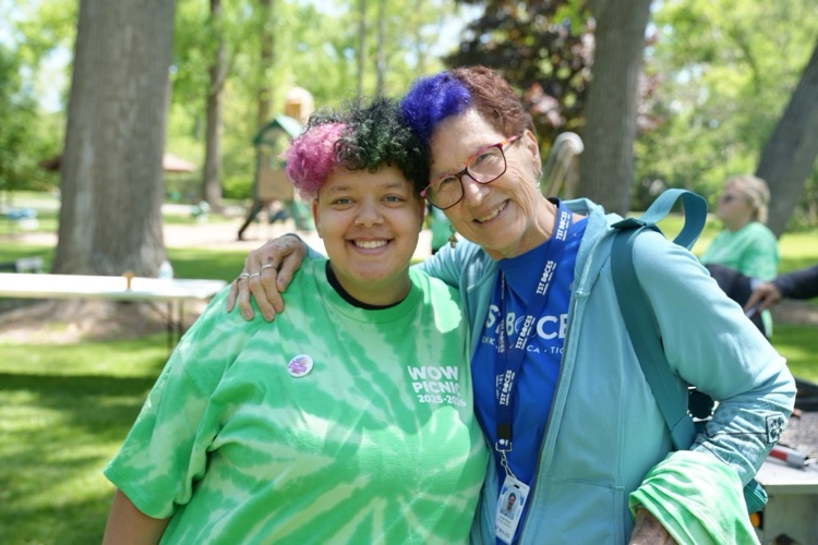 world of work student smiles with TST BOE member Linda Pasto at WOW picnic