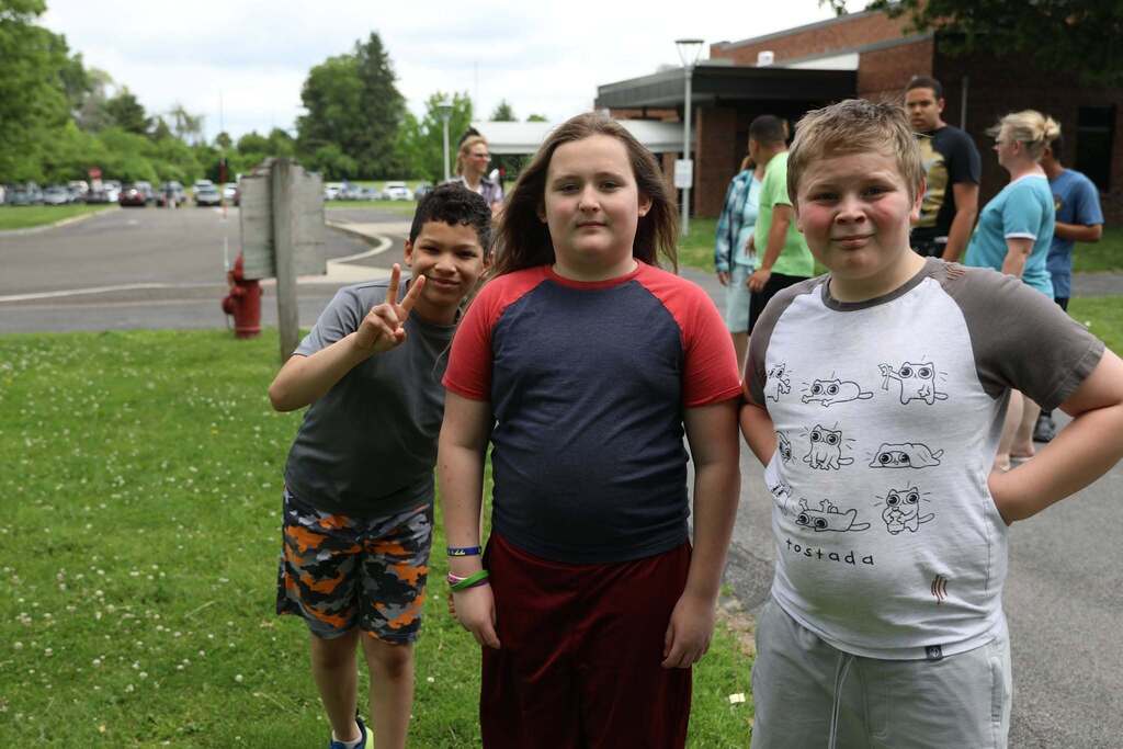 three students posing for the camera