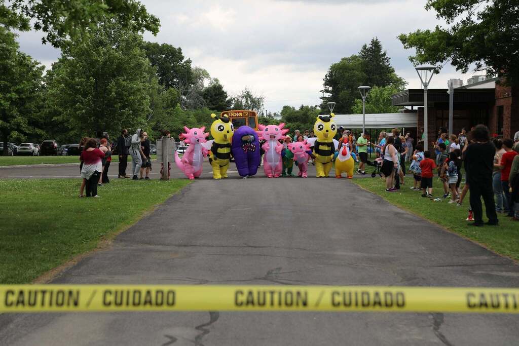 staff members in costume getting ready to race