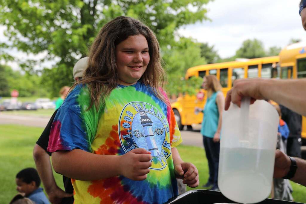 a student waiting for some water