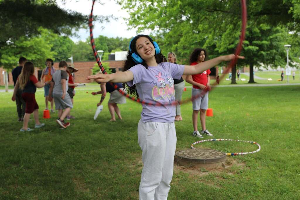 a student doing a hoolahoop