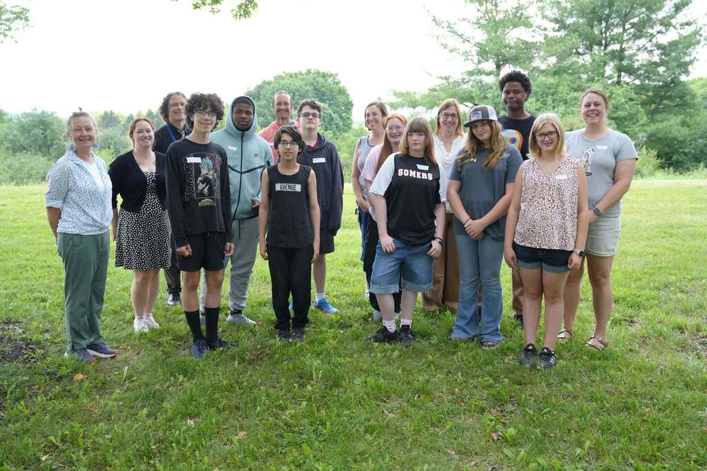 The incoming P-TECH Class of 2030 and staff gather outdoors for a group photo during Bridge Week.