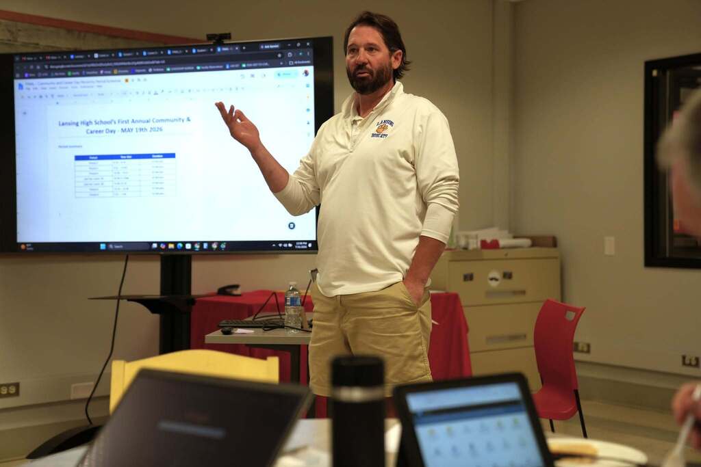 Lansing's Pat Hornbrook leads a breakout session on AI tools while participants follow along on laptops during the Regional Administrator AI Conference.