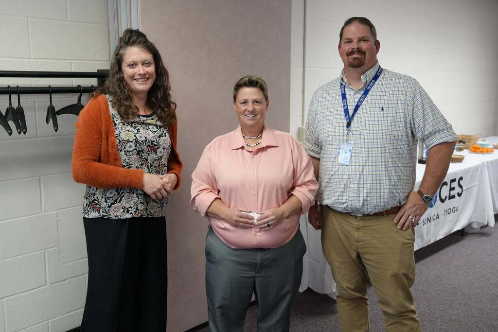 Two TST BOCES staff and a newly hired member smile together during the TST BOCES Hiring Event.