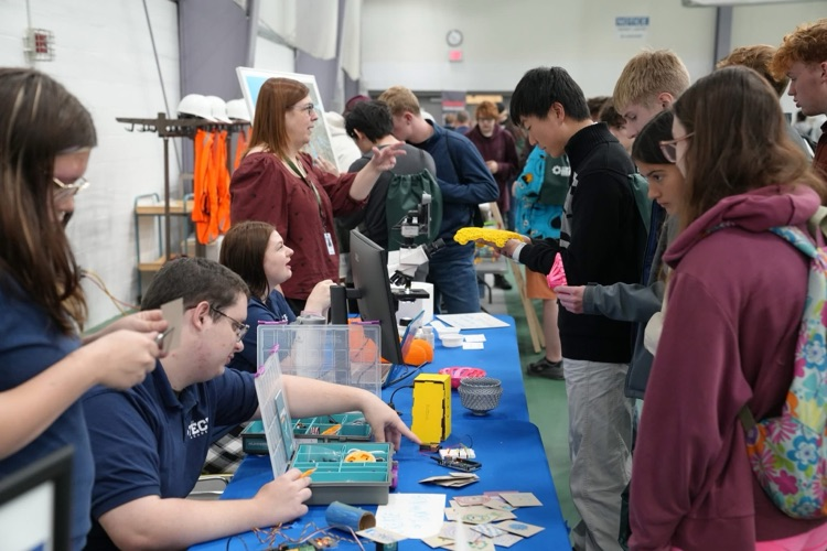 TST BOCES P-TECH students hosting an interactive project booth at the "How It's Made" Manufacturing Expo at TC3.