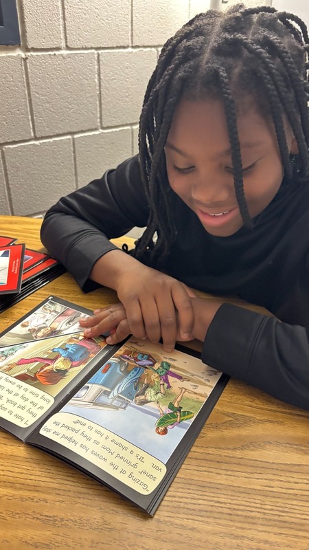 student reading using new literacy program