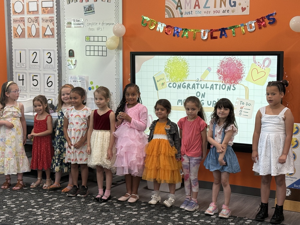 Students and families celebrate Kindergarten students. 