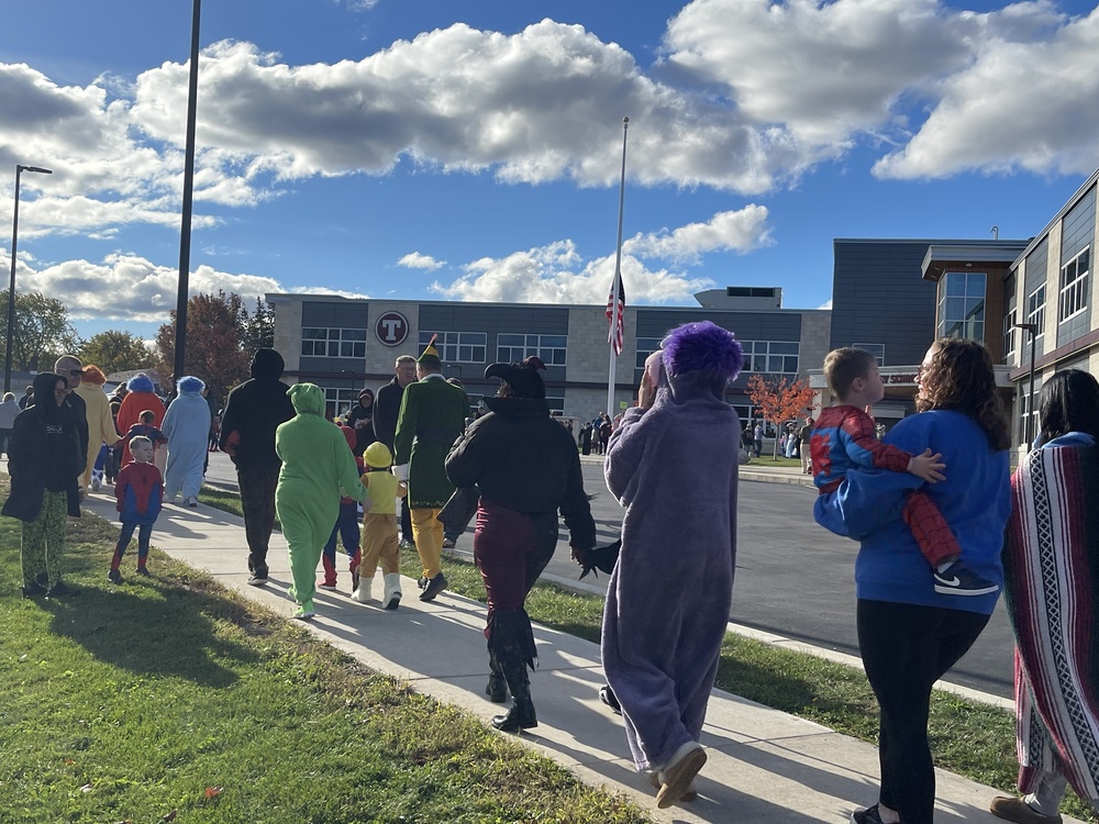 halloween parade of kids in front of school