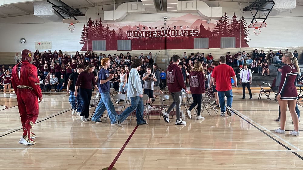 Students play musical chairs at pep rally.