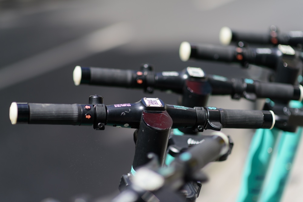 image of e-scooter handlebars in a row
